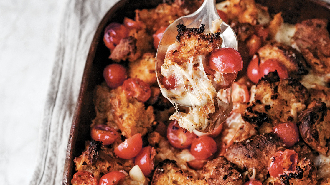 A spoonful of Baked Bread with melted Provolone cheese.