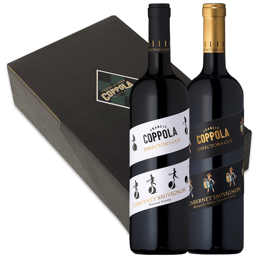 Two bottles of Coppola Director's Cut Cabernet Sauvignon, one with a white label and the other with a black label, stand in front of a black box.