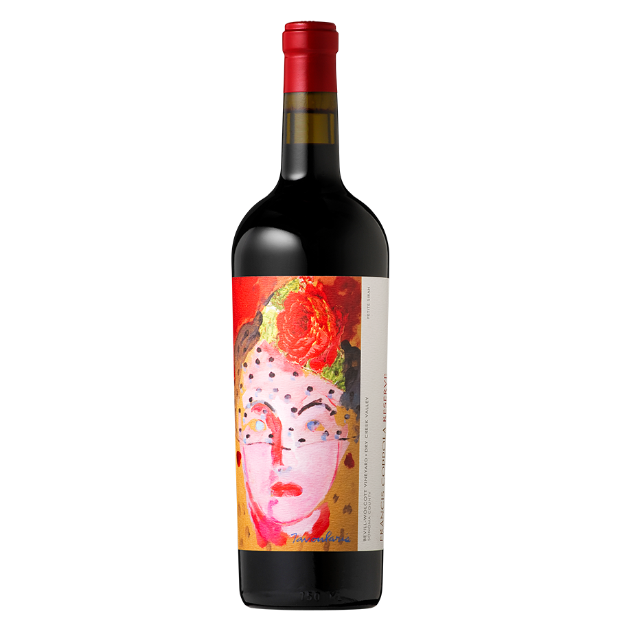 A wine bottle with a vibrant label featuring a colorful abstract portrait of a face with floral elements. The bottle has a sleek black design and a red cap.