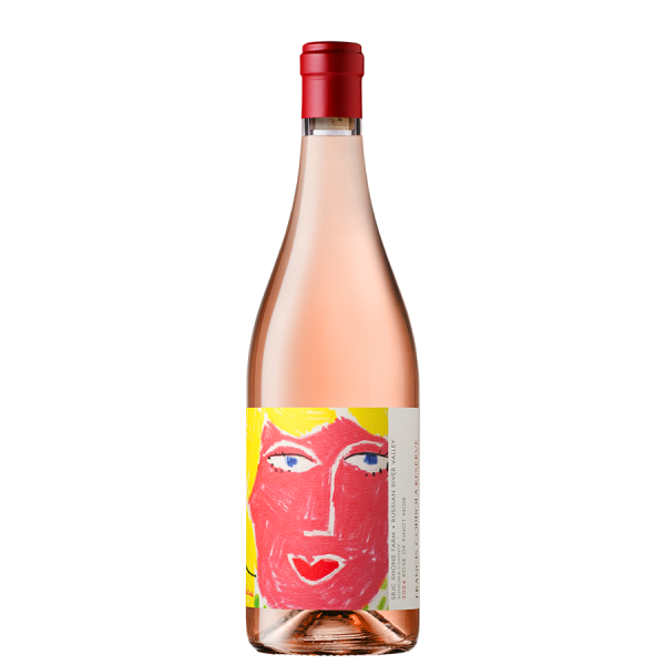 A bottle of rosé wine with a red cap, featuring a colorful label depicting a stylized face with a red complexion and blue eyes. Set against a black background.