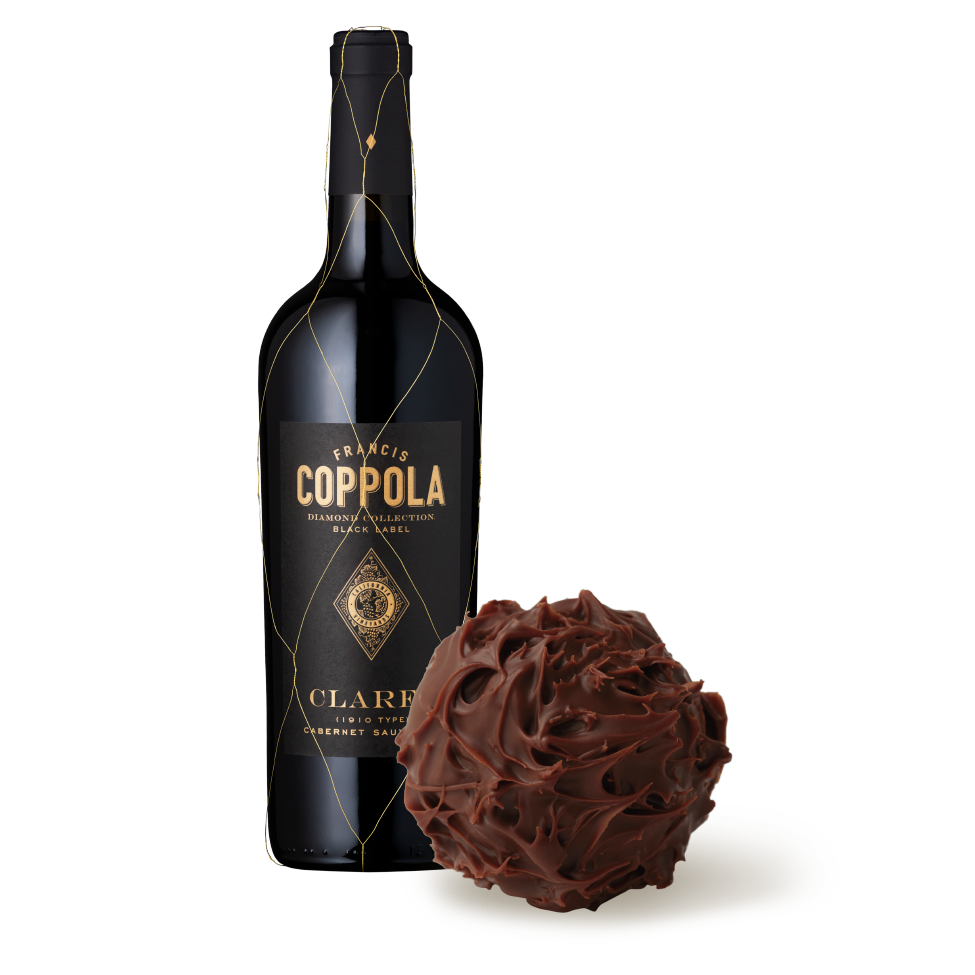 A bottle of Diamond Collection Claret pictured with a Lindt Dark Chocolate Truffle