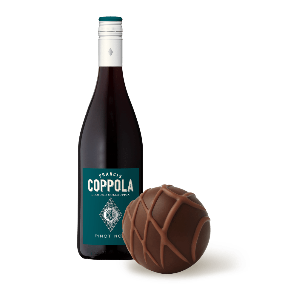 A bottle of Diamond Collection Pinot Noir pictured with a Lindt Caramel Chocolate