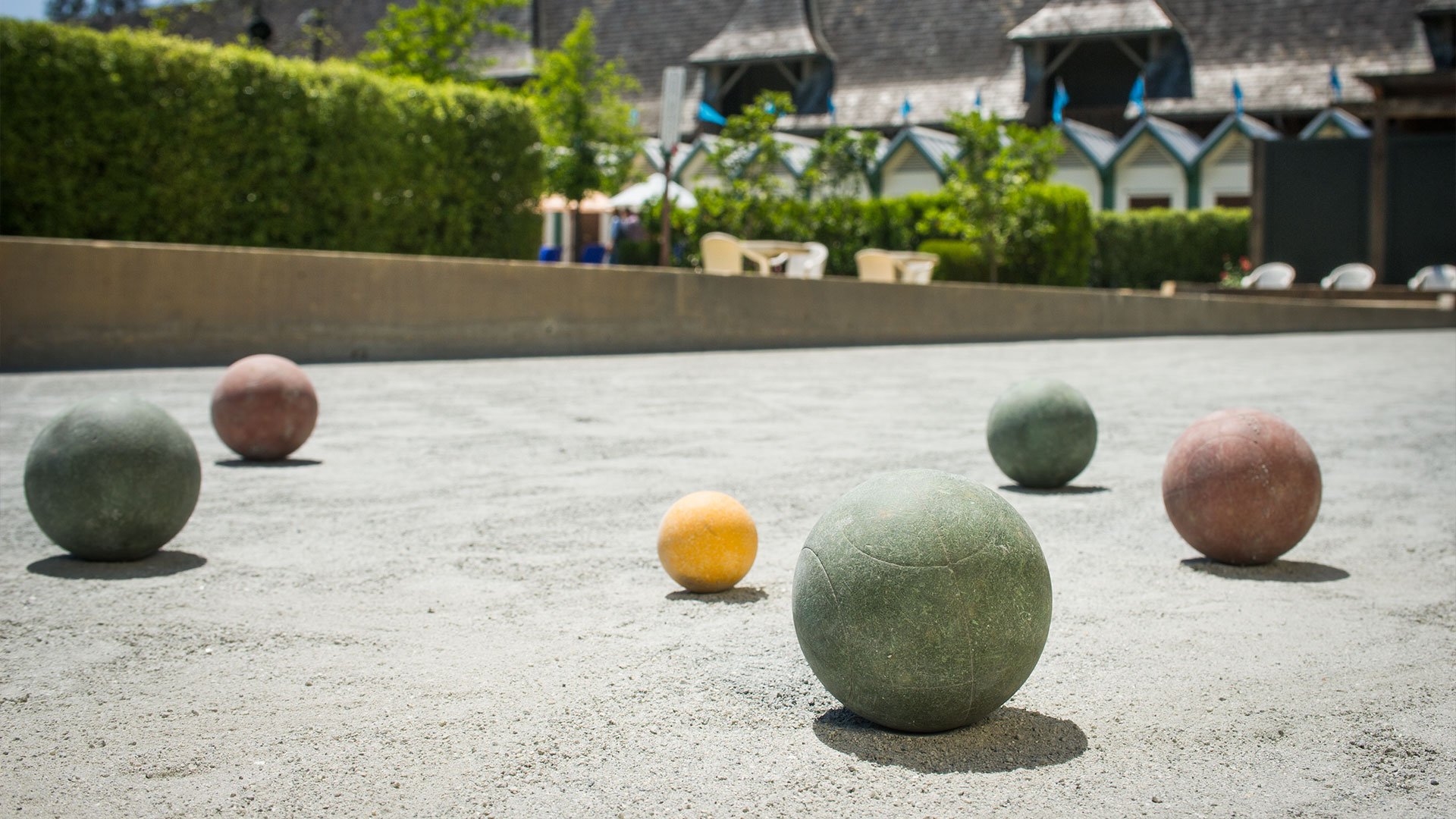 Close up view of bocce balls on a bocce ball court