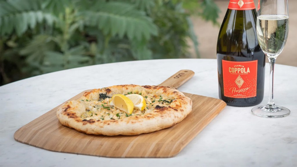 2023 Perfect Your Pizza Winner - Wine Bottle and a fresh pizza