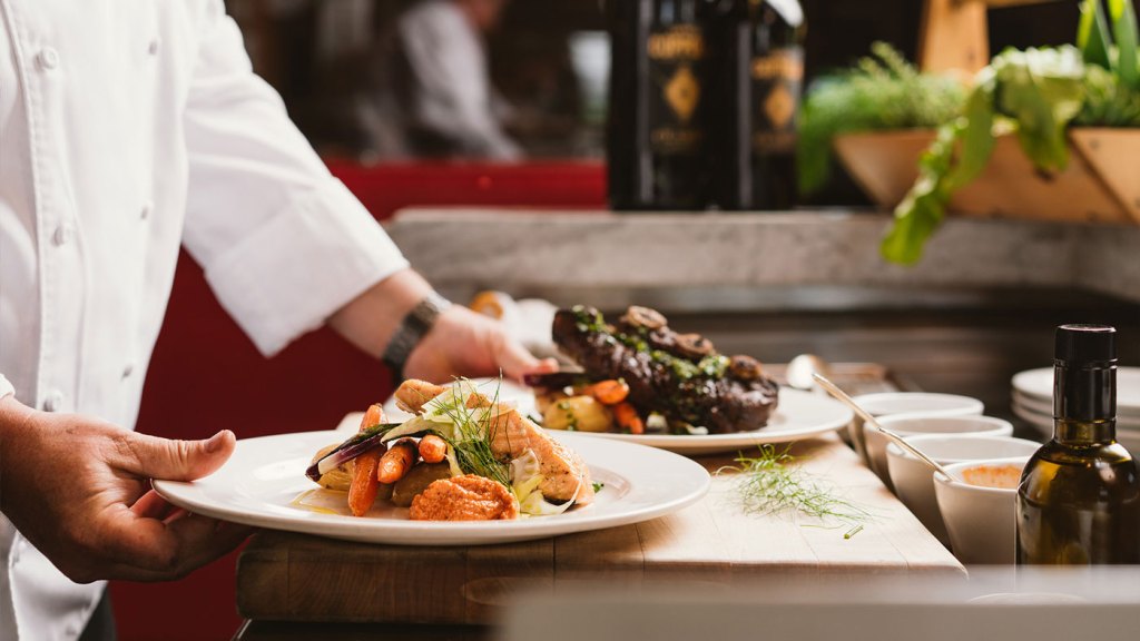 A fine dining restaurant with two plates being served